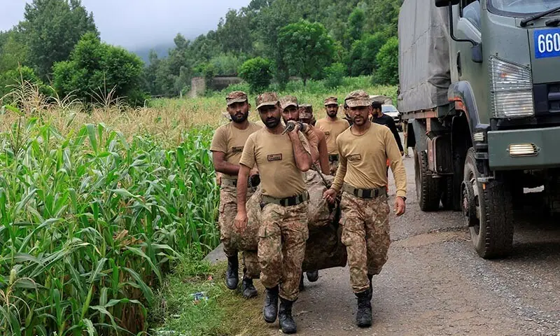 Army soldiers carry rescue equipment as they walk towards the damaged area, following a storm that caused heavy rains and flooding in Bayshonai Kalay, in Buner district, in Khyber Pakhtunkhwa on August 18, 2025. — Reuters